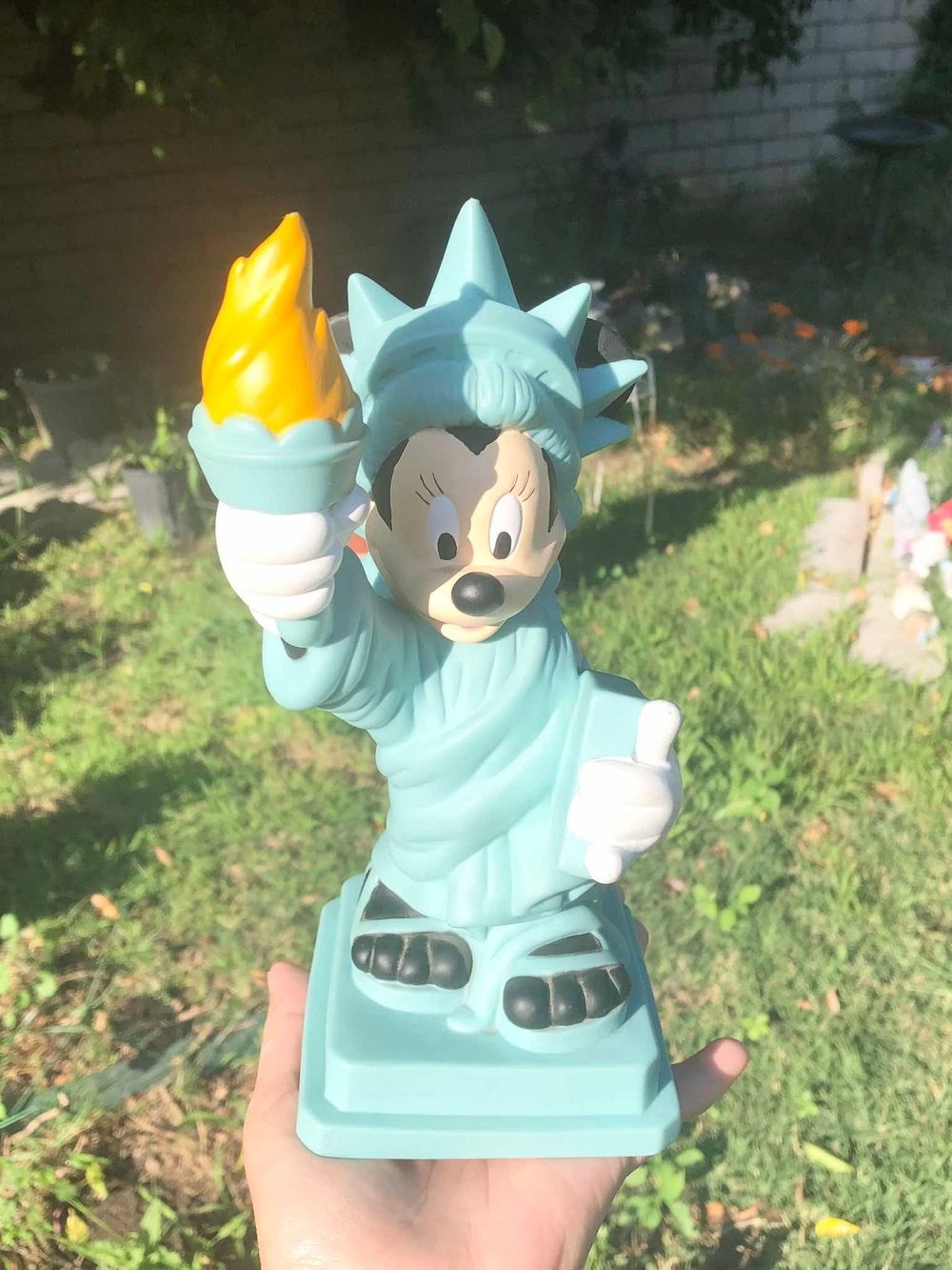 Vintage Disney collectible coin bank, featuring a Minnie Mouse Statue